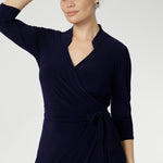 Women's wrap dress, tailored for a corporate or event setting and featuring a modern angular collar detail adds an edgy look to your work wear style. Sizes 8-24 and Proudly Made in Australia.