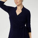 Women's wrap dress, tailored for a corporate or event setting and featuring a modern angular collar detail adds an edgy look to your work wear style. Sizes 8-24 and Proudly Made in Australia.