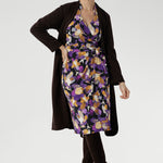 With its functioning wrap design, extended waist ties, and angular interlined collar, the Jett Dress brings a contemporary edge to your workwear wardrobe. Pair back with brown boots and a brown coat for a vibrant winter floral look.