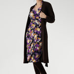 The vibrant painterly-style floral print, rich in purples and soft yellow hues, adds an artistic touch to a timeless silhouette. With its functioning wrap design, extended waist ties, and angular interlined collar, the Jett Dress brings a contemporary edge to your workwear wardrobe