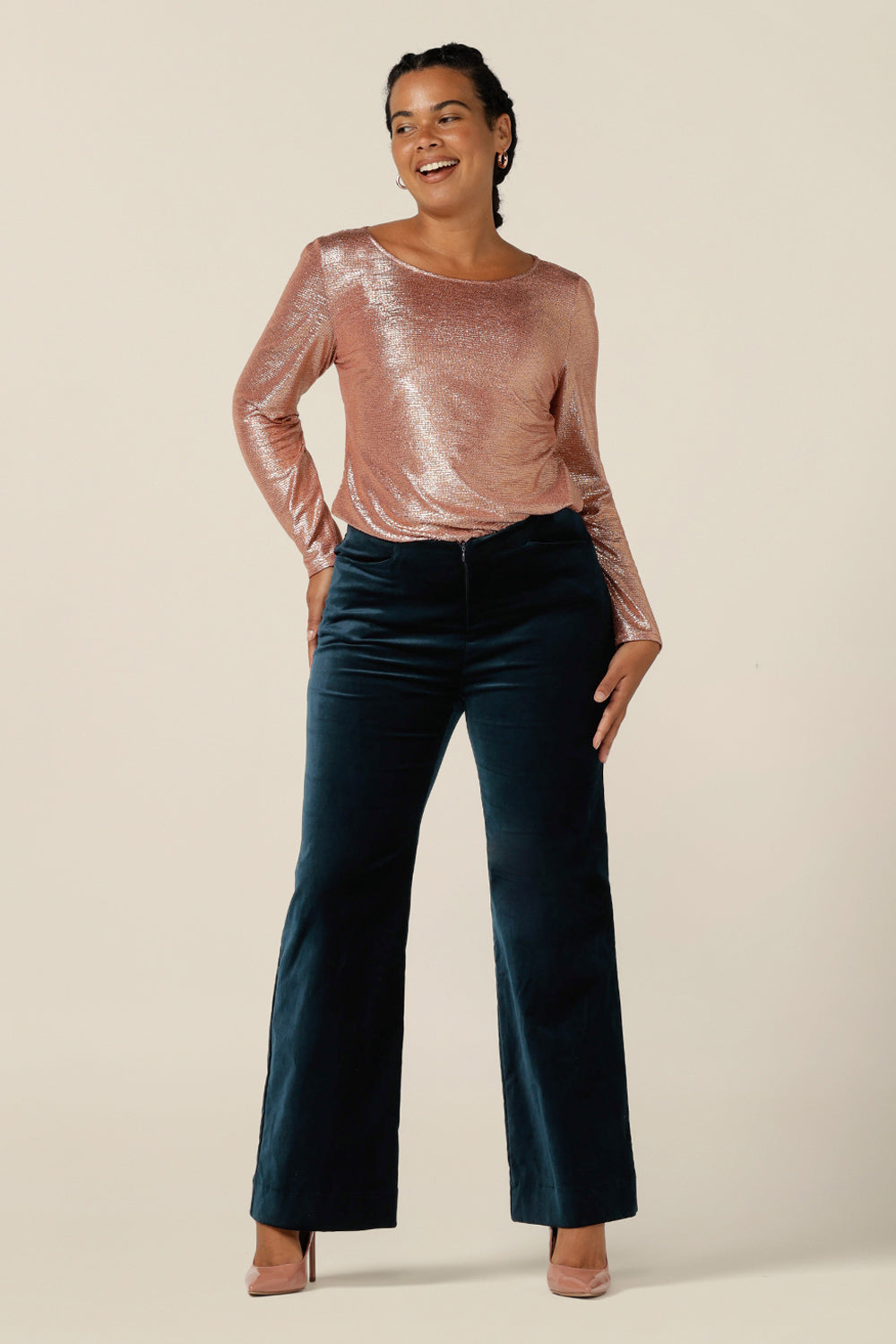 Evening and cocktail wear gets a touch of disco fever with these flared leg, tailored pants in petrol green velveteen. Worn with a sparkly pink, long sleeve top for eveningwear, these special event pants are made in Australia in sizes 8 to 24, petite to plus sizes.