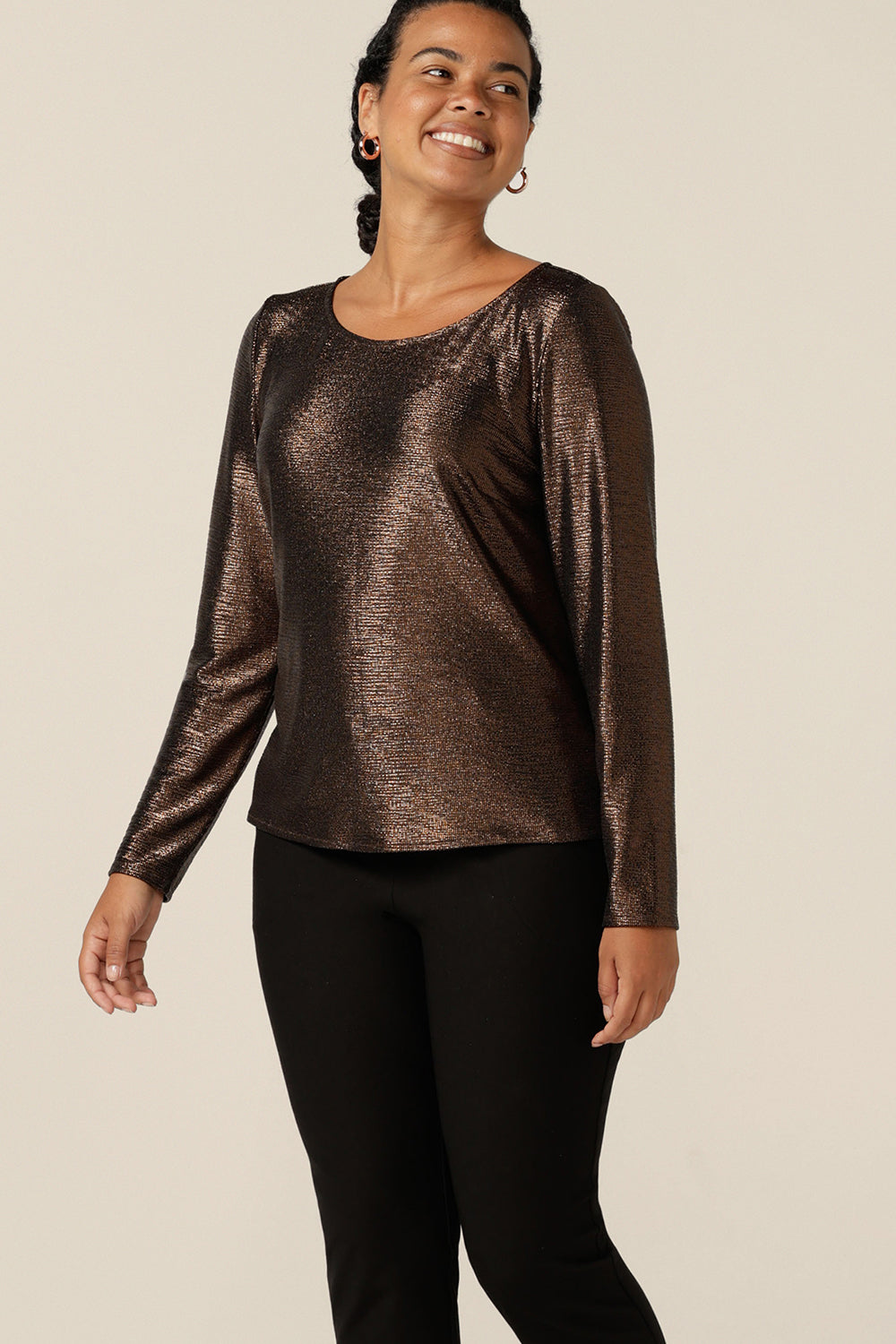  Look good in long sleeved occasionwear with this sparkly top by Australian and New Zealand women's clothing brand, L&F. With a high scoop neckline and long sleeves, this shimmering stretch jersey top is worn with slim leg black evening trousers. A comfortable, modest top for women from petite to plus sizes and great too, for 40 plus women looking for stylish cocktail and event wear.