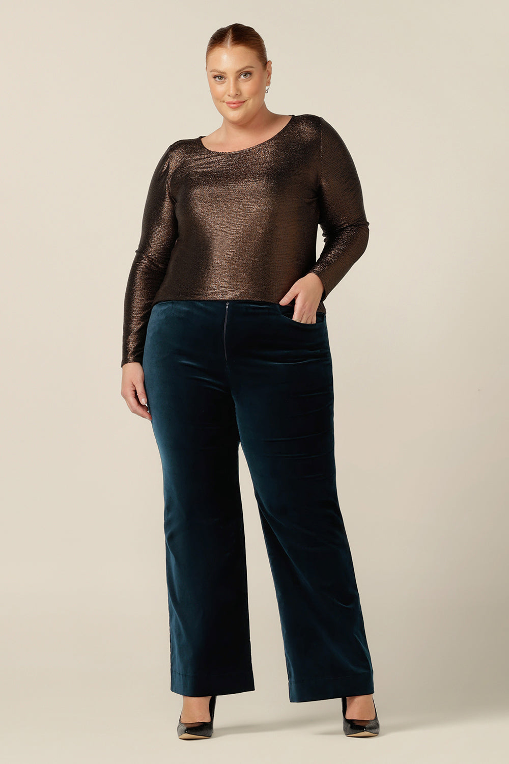 Evening and cocktail wear gets a touch of disco fever for plus size women with these flared leg, tailored pants in petrol green velveteen. Worn with a sparkly mocha brown, long sleeve top for eveningwear, these special event pants are made in Australia in sizes 8 to 24, petite to plus sizes.