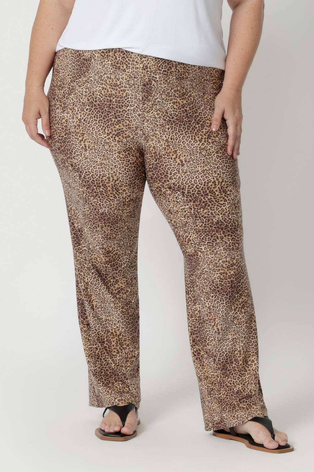 Close up image of plus sized woman wears animal printed pants that works on her body type, providing a flattering silhouette that looks fantastic. Easy car pants are a pull-on style with elasticated waistband, offering a flexible fit that’s easy to wear, without any zippers or fastenings. The soft jersey fabric stretches comfortably to move with you, providing a relaxed fit that's never restrictive. Joel Pants in Baby Animal are available in sizes 8-24.