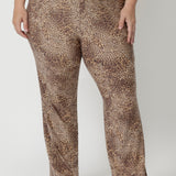 Close up image of plus sized woman wears animal printed pants that works on her body type, providing a flattering silhouette that looks fantastic. Easy car pants are a pull-on style with elasticated waistband, offering a flexible fit that’s easy to wear, without any zippers or fastenings. The soft jersey fabric stretches comfortably to move with you, providing a relaxed fit that's never restrictive. Joel Pants in Baby Animal are available in sizes 8-24.