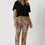 Over 40's model wears easy care pants in gorgeous animal print, made with soft touch jersey fabric. Making it a go to piece for travel and long wear. The soft jersey fabric stretches comfortably to move with you, providing a relaxed fit that's never restrictive. Available in sizes 8-24.