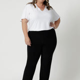 Plus sized model wears casual black pants  Whether you're at the office or on the go, these pants will keep you looking polished and feeling comfortable all day long. Leina & Fleur consider many different sizes when developing their clothes and proudly stock 8-24.