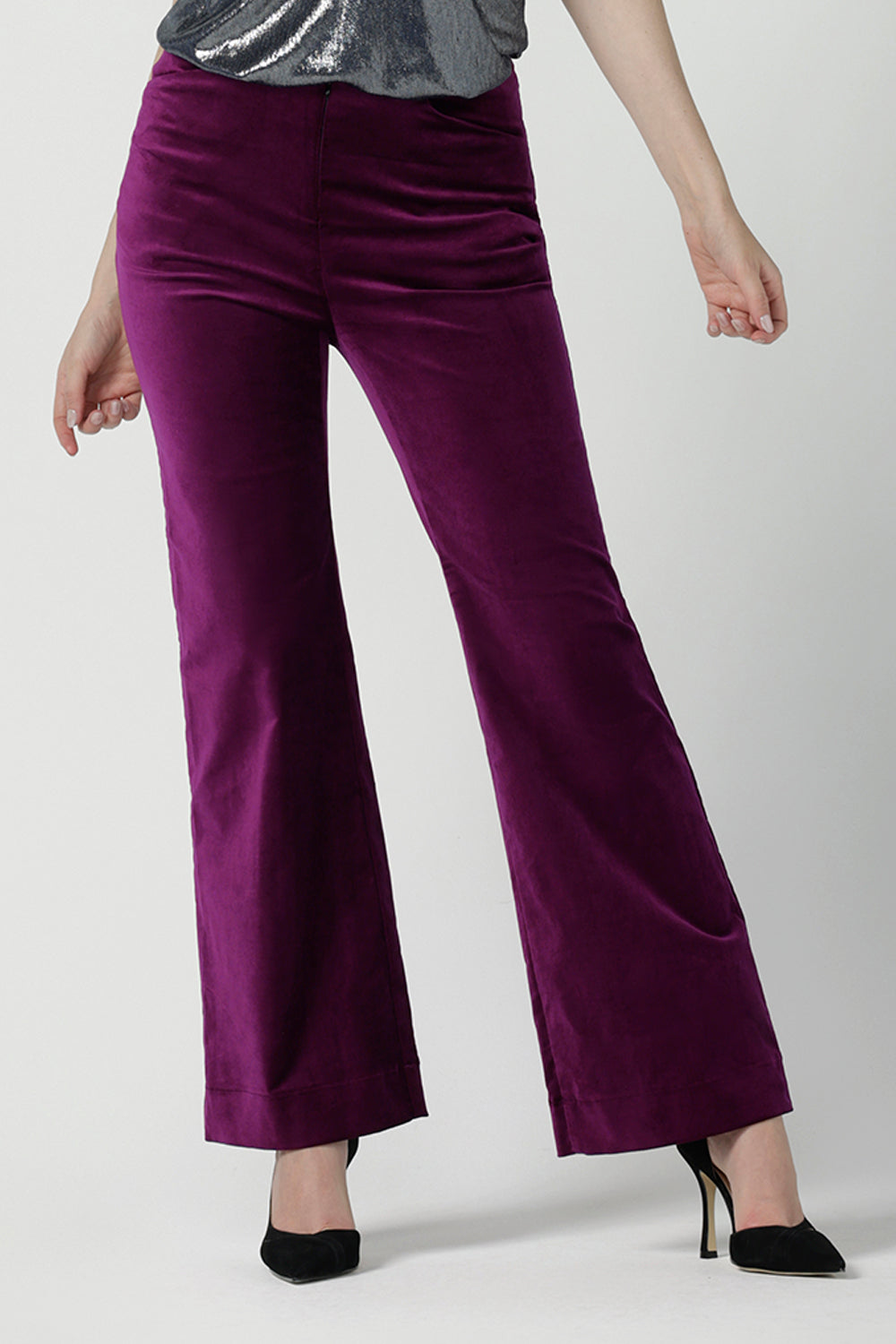 Close up of a size 10 woman wears the Jonas pant in Magenta Velveteen with a kick flare. The perfect cocktail suit set. Made in Australia for women size 8 - 24. Styled back with the Eddy Cami in Twilight.