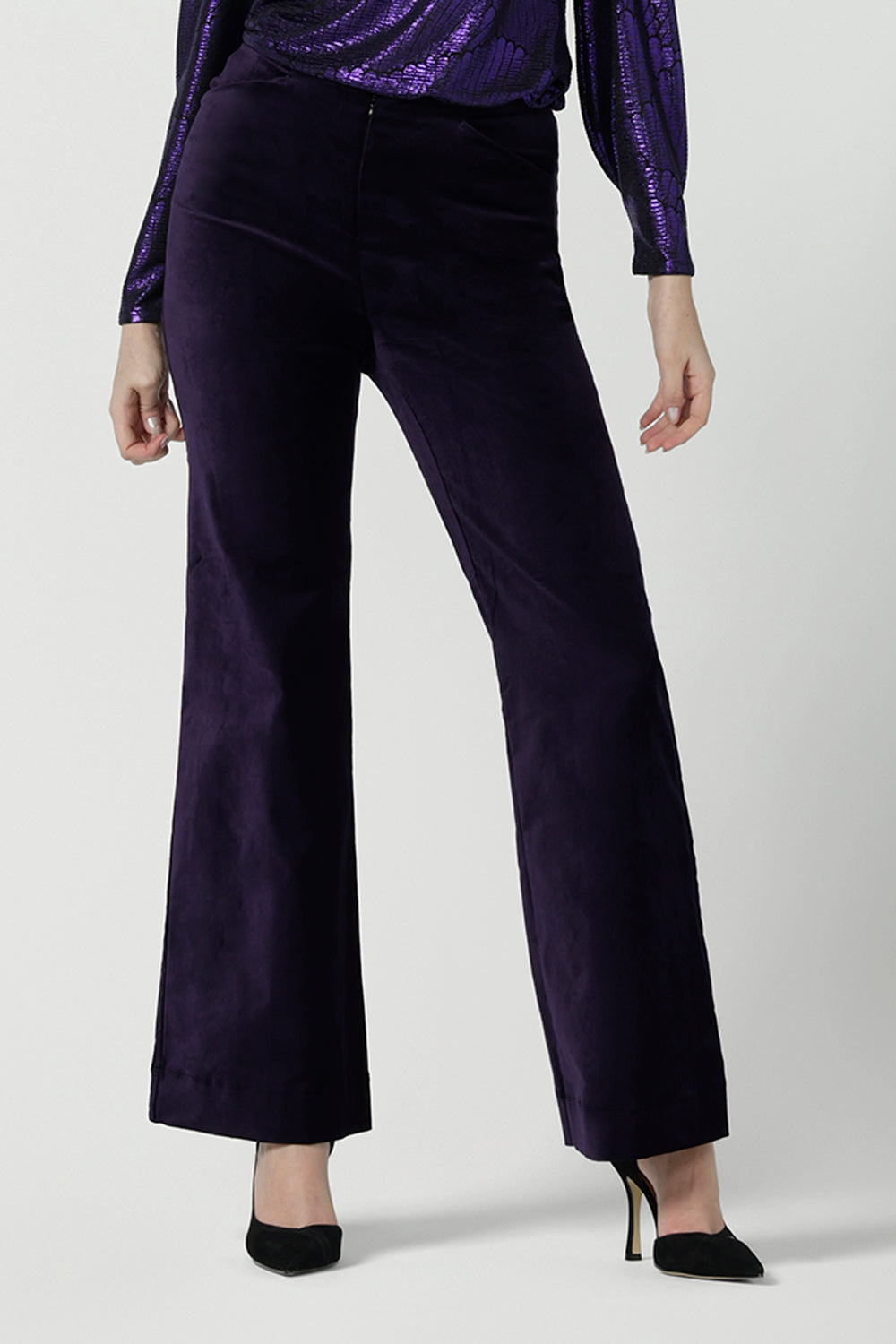 Close up of a Jonas pant in Purple Velveteen is a kick flare pant made in purple velveteen fabric. Cocktail pant suit sets. Made in Australia for women size 8 - 24.