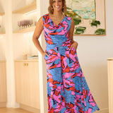 With a wide-leg silhouette, double-layer waistband, and practical side pockets, it’s finished in a striking painterly print of blue, red, and pink. Perfect for holidays, events, or adding playful charm to everyday style