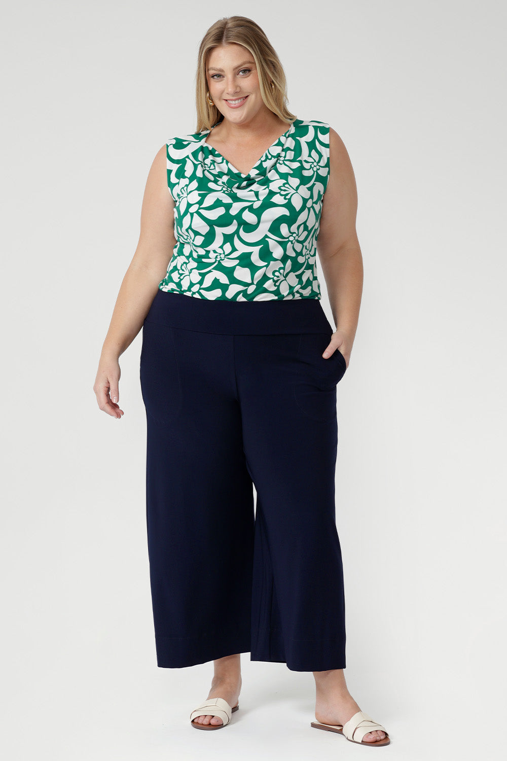 The Jade Charm print, in rich teal and soft vanilla tones, adds a contemporary, stylish touch, making it perfect for modern workwear or special occasions. 