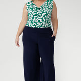 The Jade Charm print, in rich teal and soft vanilla tones, adds a contemporary, stylish touch, making it perfect for modern workwear or special occasions. 