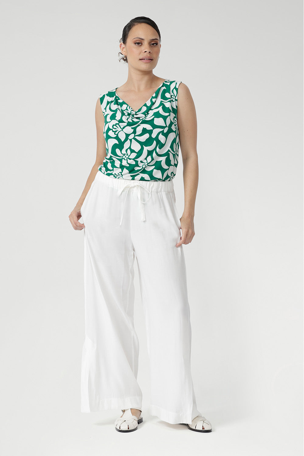 Wear it with the matching pants to create a chic faux jumpsuit, offering an elegant and versatile alternative to a dress. 