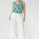 Wear it with the matching pants to create a chic faux jumpsuit, offering an elegant and versatile alternative to a dress. 