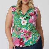 Plus sized woman wears sleeveless top in floral Malibu print. Made in Australia in sizes 8-24. Whether you're dressing up for a casual day out or a more formal summer occasion, this top is an effortless, stylish addition to your warm-weather wardrobe.