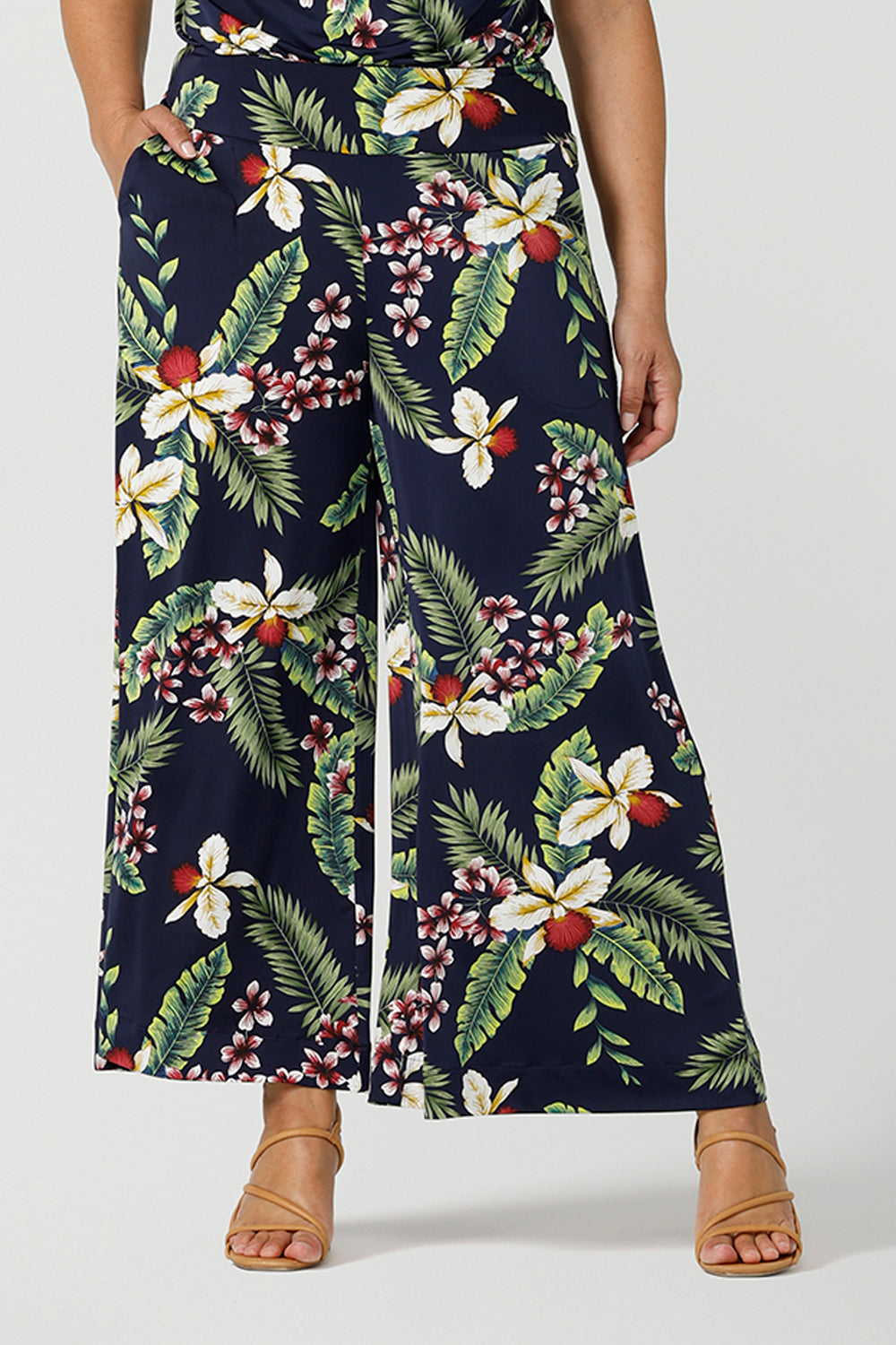 Close up of a size 12 woman wears wide leg Dany culotte in Merriment print. The perfect Christmas pant to wear for the festive season. Made in Australia for sizes 8 - 24.