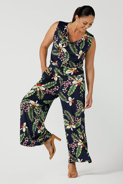 Size 12 woman wears wide leg Dany culotte in Merriment print. The perfect Christmas pant to wear for the festive season. Styled back with matching cowl neck top in Merriment. Made in Australia for sizes 8 - 24.