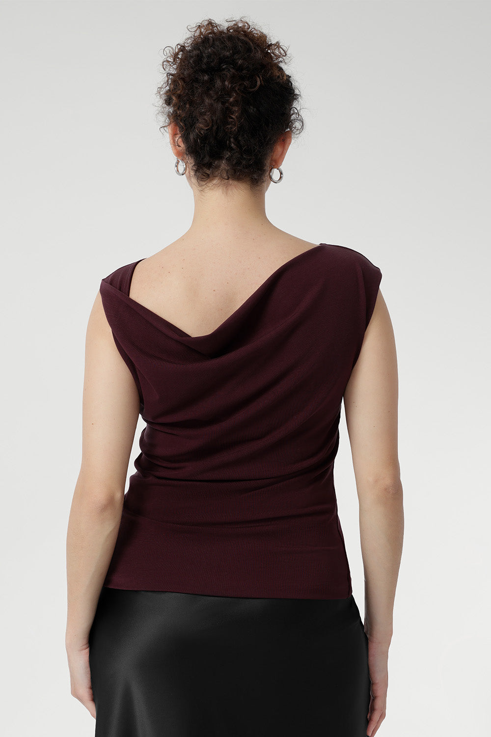 Crafted from a luxurious heavy-weight Lyocell knit fabric that feels silky to the touch and offers a rich, elegant appearance, the Jordan Top in Wine is designed for versatile, stylish wear. 