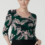 The Jules top in alpine is a green leaf printed top with a scoop neckline. Jersey top with 3/4 sleeves. Made in Australia for women size. 8 - 24. 