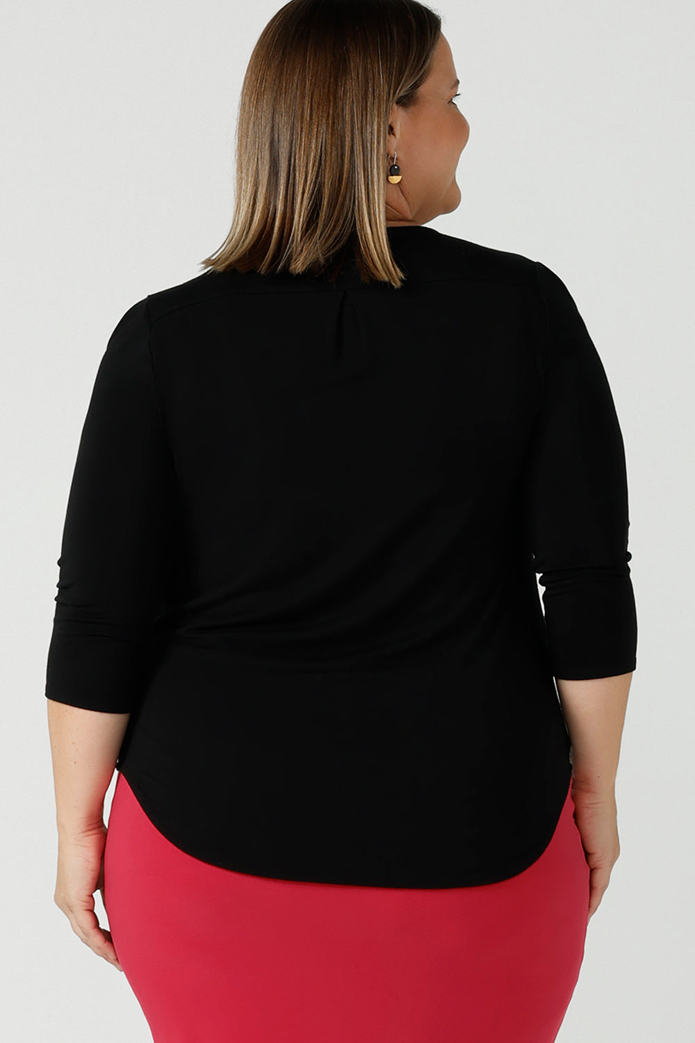 Jules in black bamboo with a scoop neckline and 3/4 sleeve.  In soft black bamboo, this top is the perfect corporate casual workwear top. Designed and made in Australia for Leina & Fleur sizes 8 - 24. Styled on a curvy size 18 model. 