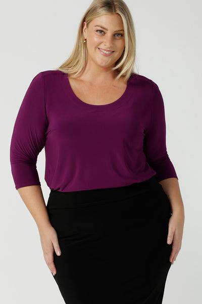 A size 18 woman wears the Jules top in Magenta. A soft jersey easy care 3/4 sleeve top ion rich purple magenta colour. Scoop neckline and made in Australia for women size 8 - 24. 