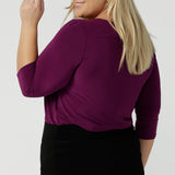 Back view of a size 18 woman wears the Jules top in Magenta. A soft jersey easy care 3/4 sleeve top ion rich purple magenta colour. Scoop neckline and made in Australia for women size 8 - 24.