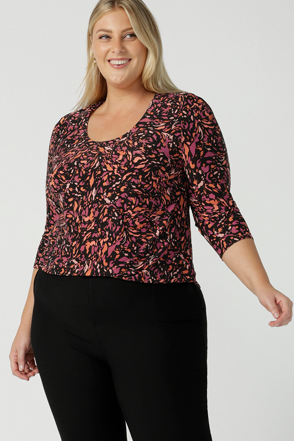 Close up of a size 18 woman wears the Jules Top in Terrazzo, a scoop neckline style with 3/4 sleeves. A comfortable easy care jersey style made in Australia for women size 8 - 24.