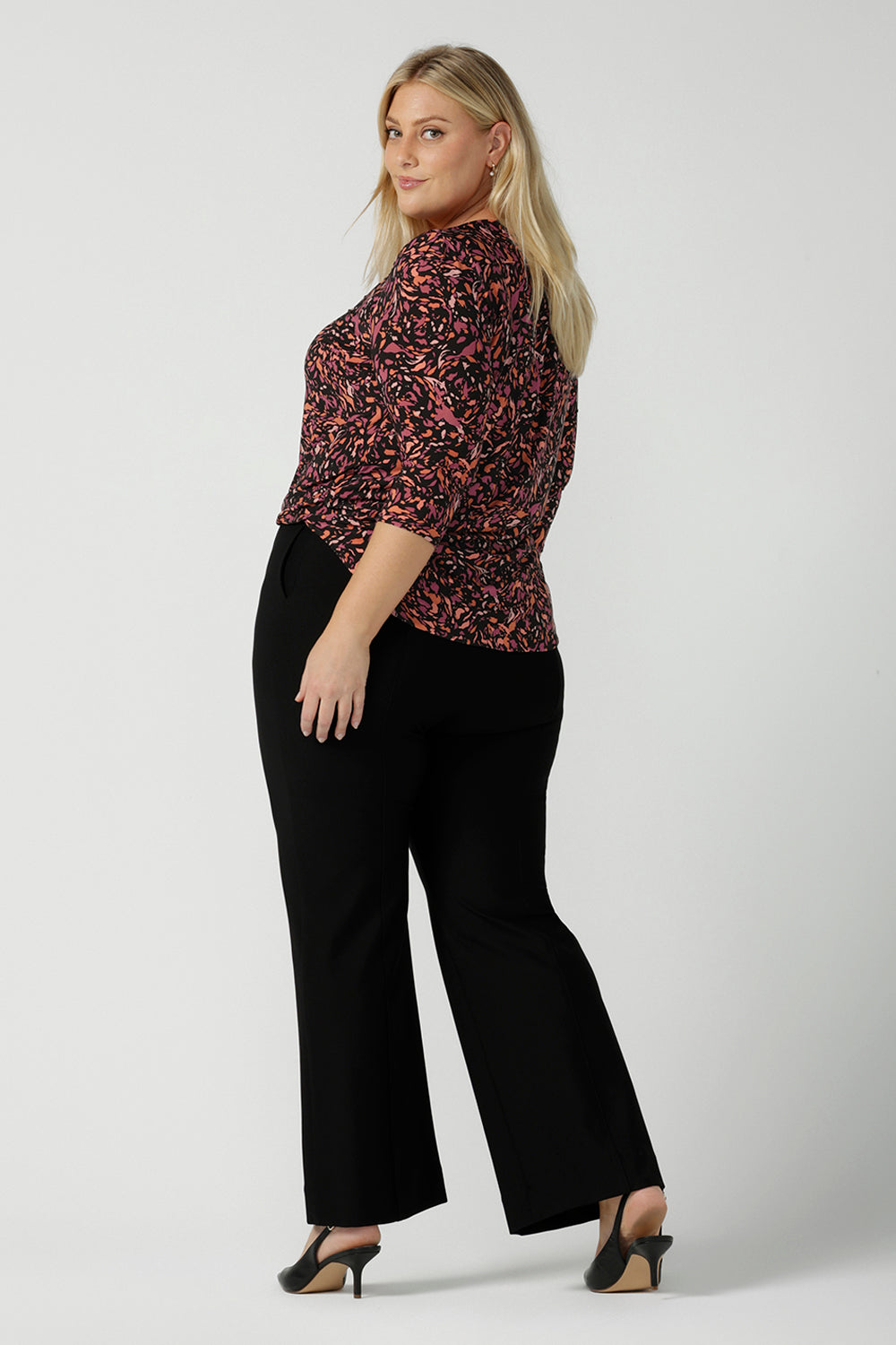 Back view of a size 18 woman wears the Jules Top in Terrazzo, a scoop neckline style with 3/4 sleeves. A comfortable easy care jersey style made in Australia for women size 8 - 24.