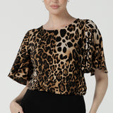 A size 10 woman wears the Juniper top in Gold Leopard. A flutter sleeve jersey top with flutter sleeves. Leina & Fleur are an Australian made fashion label on the Gold Coast Australia. Offering Petite to Plus size fashion 8 - 24. Comfortable workwear for women. 