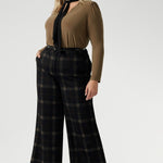 The Kade Pant brings timeless elegance with a contemporary twist, featuring a high-rise fit and full-length, wide-leg cut that flatters and elongates. A tailored waistband with a fly front and hook-and-bar closure offers a smooth, secure fit, while belt loops, back darts, and side front pockets add classic suiting details with a modern edge.