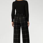 The Kade Pant forms part of the Cocoa Plaid collection—a sophisticated check in rich navy and graphite tones. A wide-leg cut that flatters and elongates. A tailored waistband with a fly front and hook-and-bar closure offers a smooth, secure fit, while belt loops, back darts, and side front pockets add classic suiting details with a modern edge.