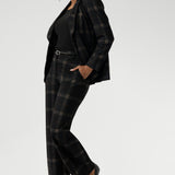 Available in classic black or paired with the Cocoa Plaid print—a deep, richly woven pattern in navy and graphite—the suiting range offers multiple options to suit your personal style. Choose from tapered leg pants for a streamlined profile, or wide leg pants for a more relaxed yet equally refined silhouette.