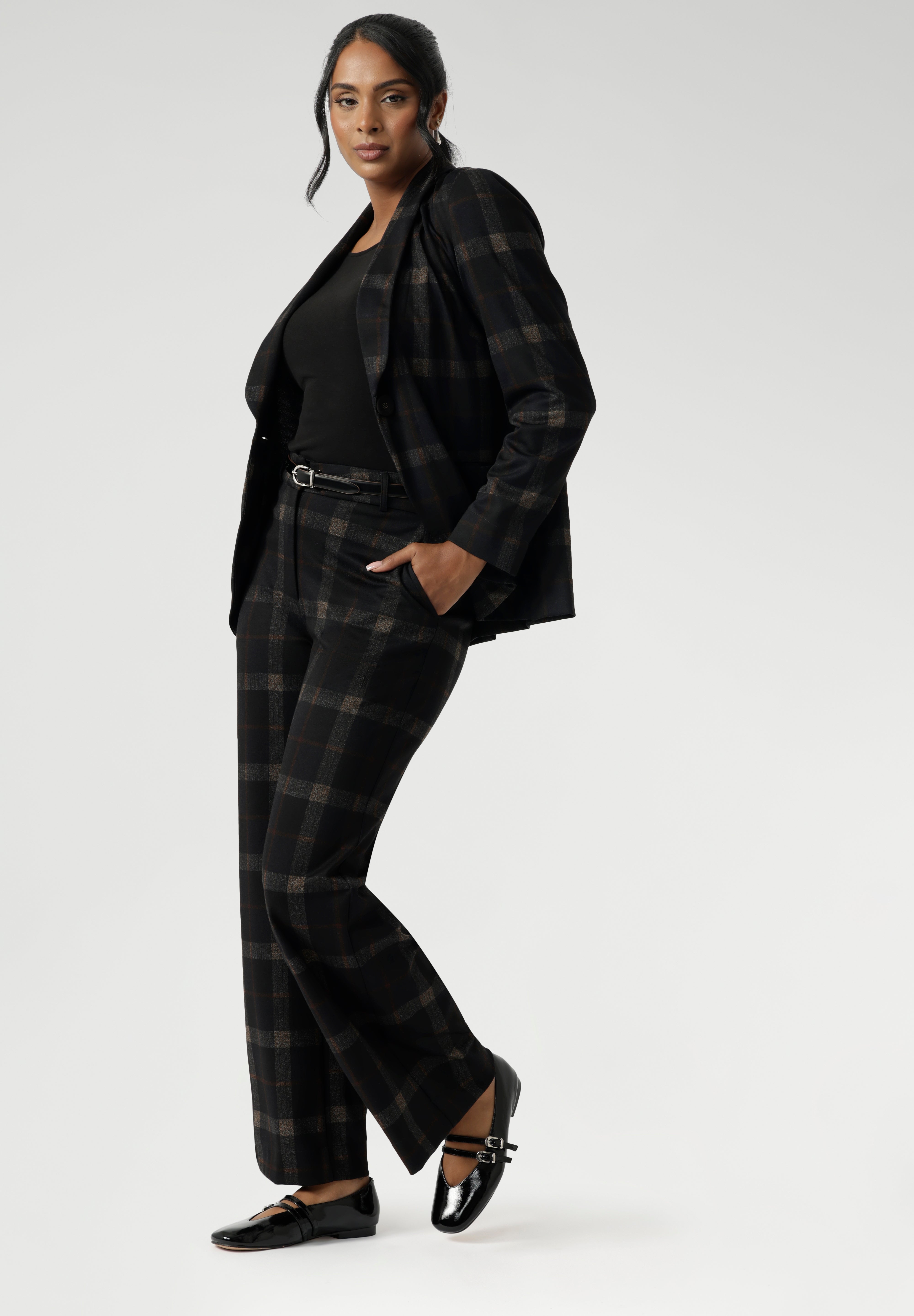 Available in classic black or paired with the Cocoa Plaid print—a deep, richly woven pattern in navy and graphite—the suiting range offers multiple options to suit your personal style. Choose from tapered leg pants for a streamlined profile, or wide leg pants for a more relaxed yet equally refined silhouette.