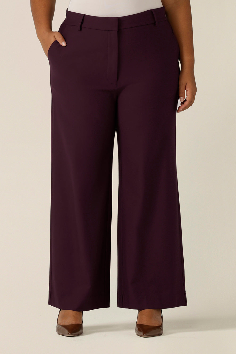 Great workwear pants, these wide leg, tailored trousers in Mulberry are shown on a curvy, size 18 figure and are styled for easy office wear. Made in Australia by Australian and New Zealand women's pants experts, L&F, these easy-care pants are comfortable for work and corporate wear.