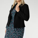 What sets Kadence apart is its versatility—this is a dress made for layering. Pair it with a tailored blazer for a polished workday look, or layer it under a trench or longline knit on cooler days. Its simple pull-on design and easy-care fabric make it an ideal piece for travel, busy mornings, or anytime dressing well needs to be uncomplicated.
