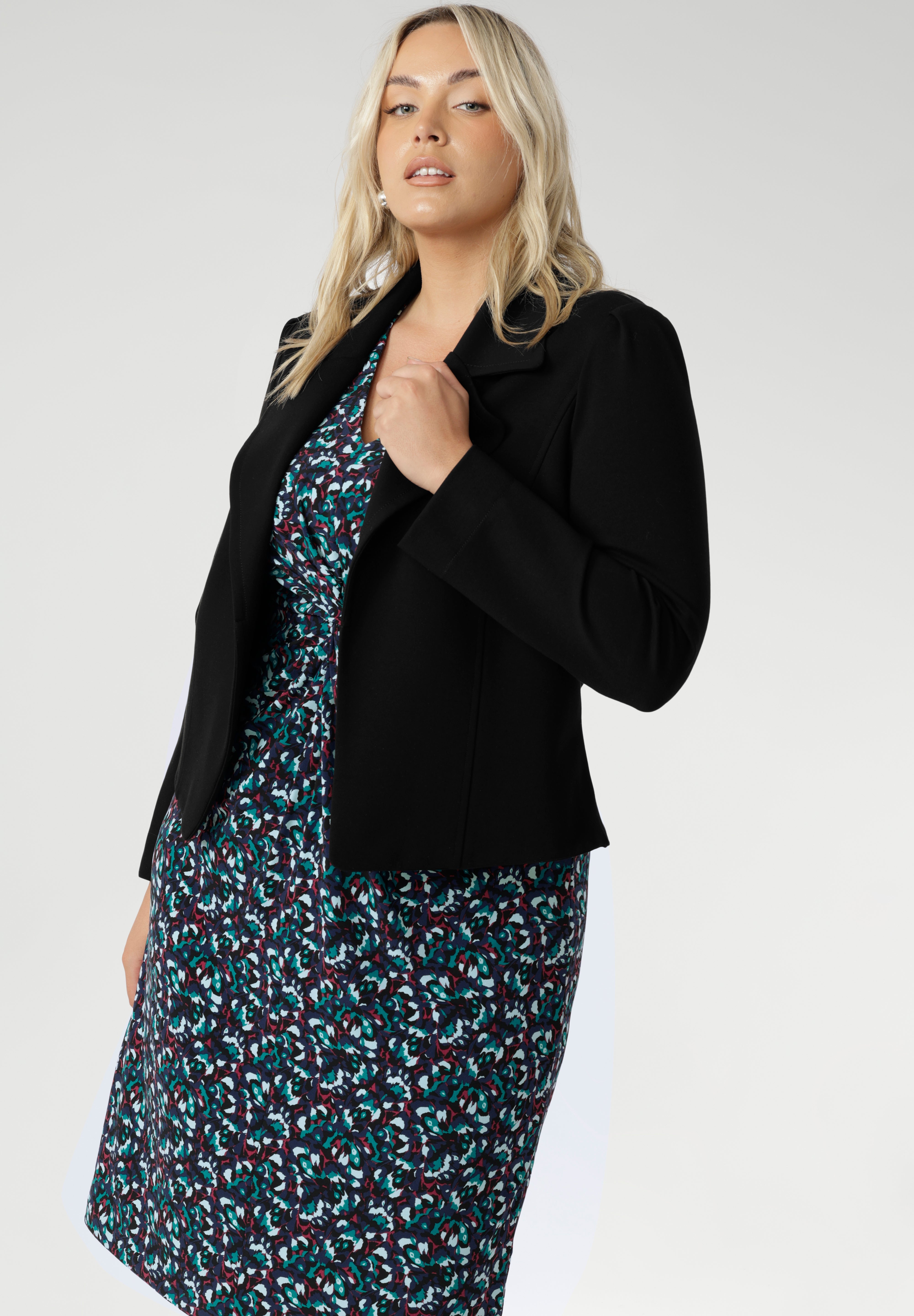 What sets Kadence apart is its versatility—this is a dress made for layering. Pair it with a tailored blazer for a polished workday look, or layer it under a trench or longline knit on cooler days. Its simple pull-on design and easy-care fabric make it an ideal piece for travel, busy mornings, or anytime dressing well needs to be uncomplicated.