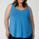 Plus Sized Model wears bamboo cami that is lightweight and breathable. Designed for all-day wear, combining practicality with timeless style. Whether layered or worn on its own, this cami ensures you stay cool, chic, and comfortable no matter where the day takes you. Leina & Fleur Stock this cami in sizes 8-24.