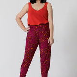 Petite model wears tangerine bamboo cami paired back with paisley printed pants for chic summer ensemble. V neck design featured in the front and back of the cami has been created to flatter every sizes through 8-24.