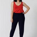 Whether paired with shorts dressed up with tailored pants as shown in the image. This cami is a must-have for any summer wardrobe. Comfortable, breathable, and effortlessly chic, it’s the perfect piece to stay cool and confident throughout the season. Add a pop of tangerine colour to your wardrobe with this cami in sizes 8-24.