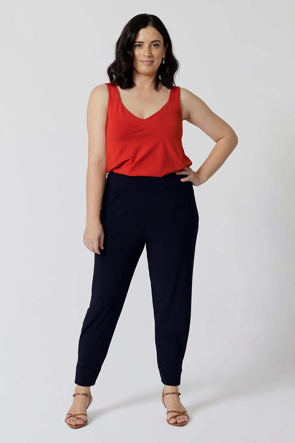 Whether paired with shorts dressed up with tailored pants as shown in the image. This cami is a must-have for any summer wardrobe. Comfortable, breathable, and effortlessly chic, it’s the perfect piece to stay cool and confident throughout the season. Add a pop of tangerine colour to your wardrobe with this cami in sizes 8-24.