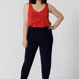 Whether paired with shorts dressed up with tailored pants as shown in the image. This cami is a must-have for any summer wardrobe. Comfortable, breathable, and effortlessly chic, it’s the perfect piece to stay cool and confident throughout the season. Add a pop of tangerine colour to your wardrobe with this cami in sizes 8-24.