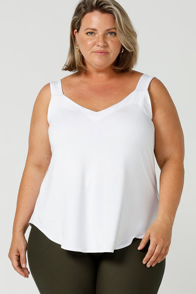 a plus size 18, fuller figure woman wears a bamboo cami. In white bamboo jersey, this top is a good addition to your capsule wardrobe for weekend wear, work and travel. Shop Australian-made dresses online is sizes 8 to 24.