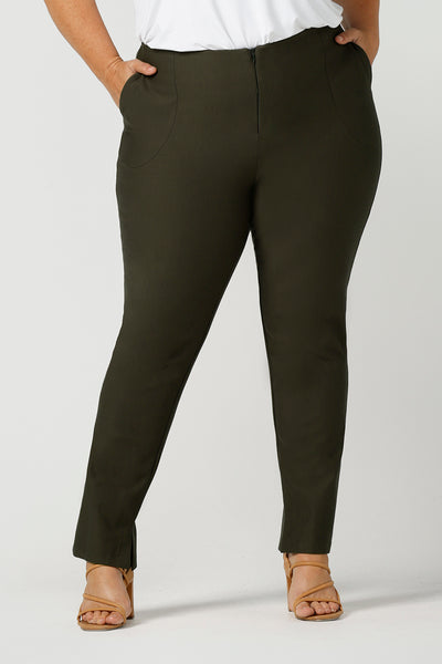 In olive green, these slim leg women's pants are great professional work and office wear trousers. Made in Australia by affordable, ethical clothing brand, Leina & Fleur these stretch pants are shown on a size 18, plus size woman. Good quality pants for your capsule wardrobe, shop ladies clothing online in petite to plus sizes at Leina & Fleur's online boutique. 