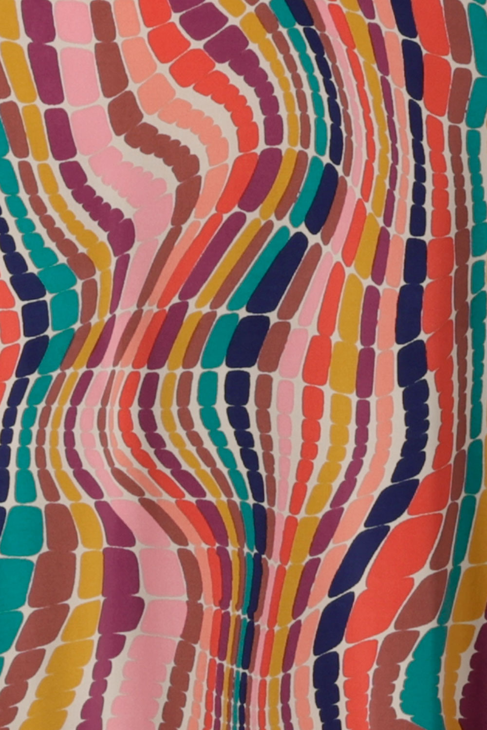 Kaleidoscope swirl print in rainbow. Jersey material and made in Australia for sizes 8 - 24.
