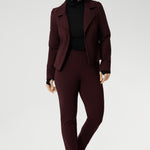 Introducing the Kean High Turtleneck Top from our Light Layers collection—a stylish and functional wardrobe essential designed to keep you comfortable as the seasons change. Made from luxurious blend of lightweight TENCEL™ and wool, offering breathable warmth without the bulk. Over 50s model wears Kean Top with burgundy suiting and black loafers for warm and elevated corporate look.