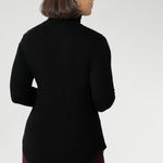 This black long-sleeve top is crafted from a luxurious blend of lightweight TENCEL™ and wool, offering breathable warmth without the bulk.