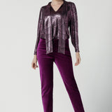 A size 10 woman wears the Keaton Pant in Magenta velveteen. Stylish up late evening wear. Size 10 up late. 