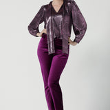 A size 10 woman wears the Keaton Pant in Magenta. Cocktail suit sets for women. Made in Australia for women size 8 - 24. For petite to plus size women made in Australia. 