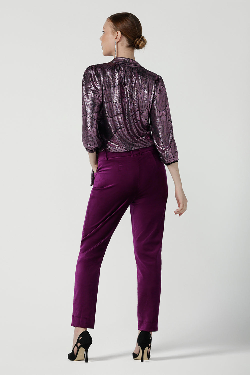 Back view of a size 10 woman wears the Keaton Pant in Magenta velveteen. Stylish up late evening wear. Size 10 up late.