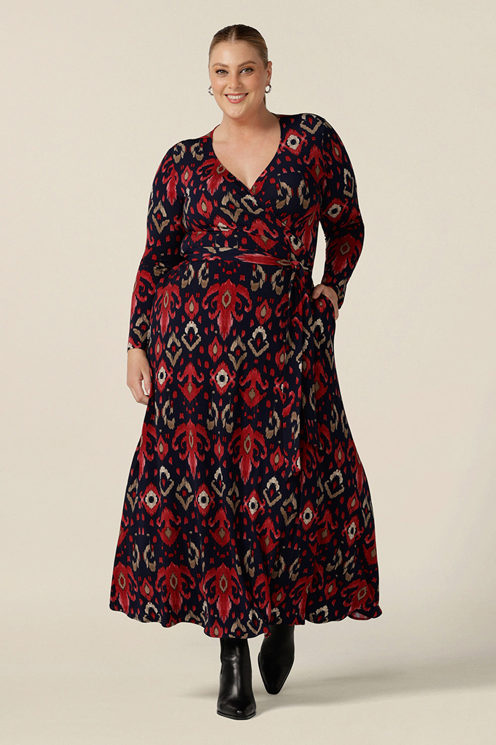 A great maxi dress for plus size women, the Kimberly Maxi Dress in Ikat red and navy print, is a full length jersey wrap dress with long sleeves. Shown on a size 18 woman, this maxi dress is made in Australia in sizes 8 to 24.
